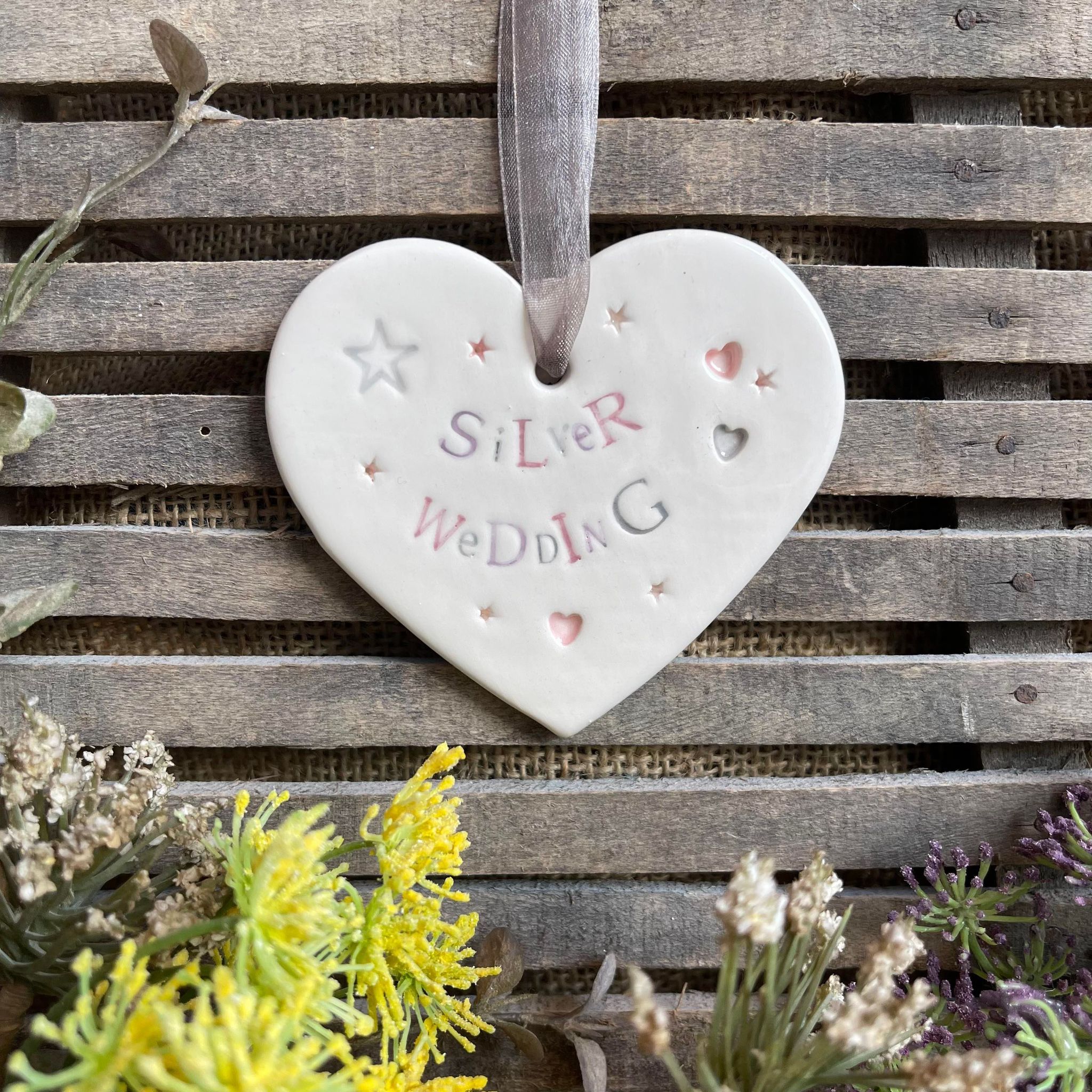 White ceramic hanging heart saying Silver Wedding