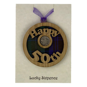 A unique keepsake gift with a Scottish twist.  The sixpence is mounted onto a round hanging oak veneered wood with tartan inserts, mounted on card and packaged in clear cellophane packets.  'Happy 50th' is cut into the wooden hanging.