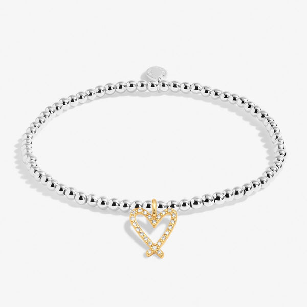 Joma beaded stretch bracelet with gold plated hanging heart charm