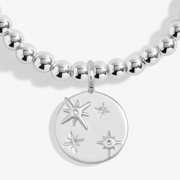 Joma stretch beaded bracelet with star engraved disc charm