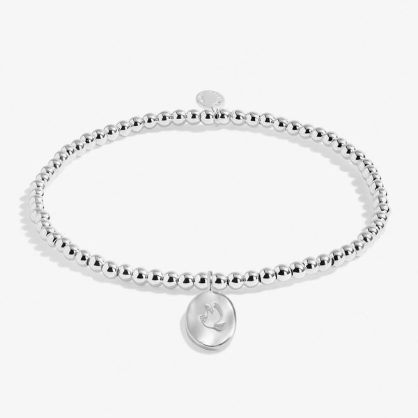 Joma jewellery special thoughts and prayers beaded stretch bracelet with hanging oval charm with delicate cut out dove.