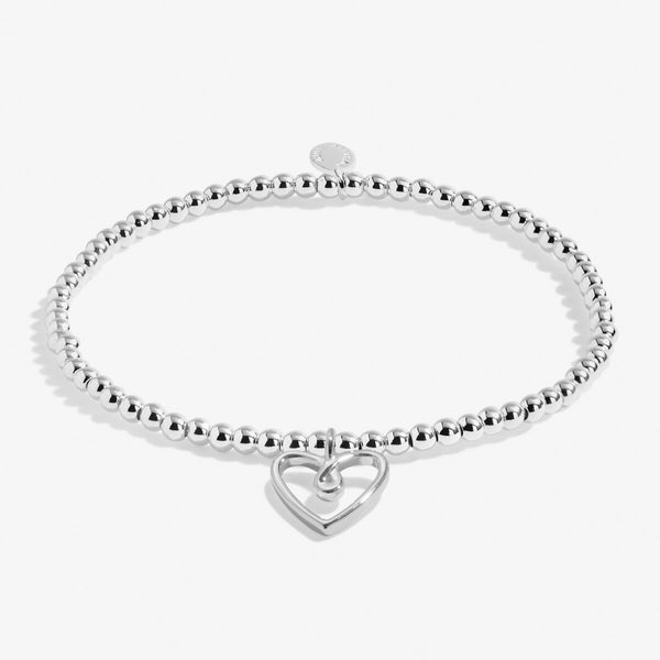 Joma jewellery silver plated beaded bracelet with hanging heart charm.