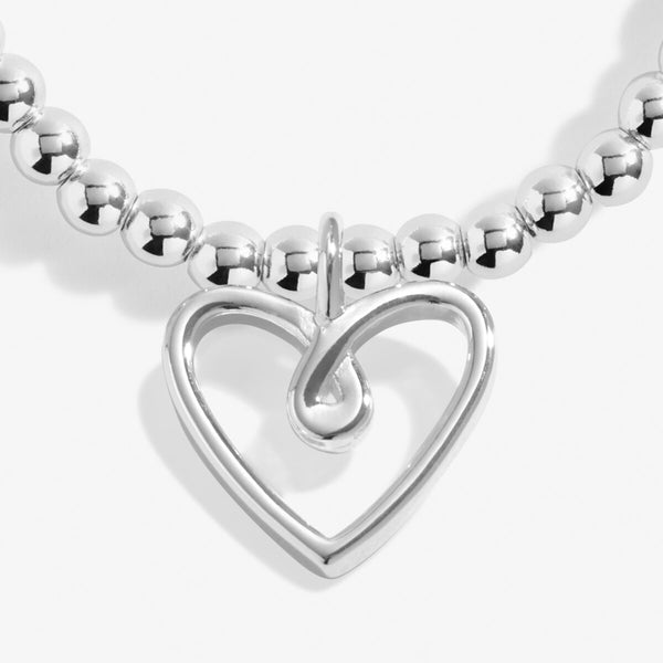 Joma jewellery silver plated beaded bracelet with hanging heart charm.