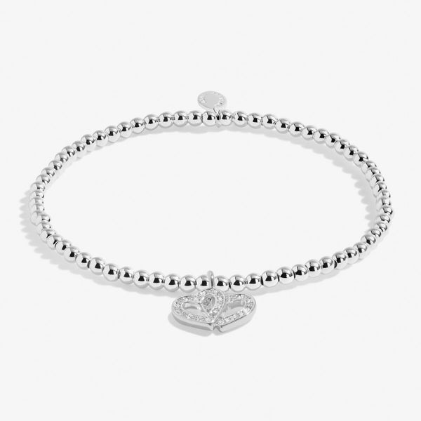 Joma jewellery silver plated beaded bracelet with hanging double heart charm with sparkle detail.