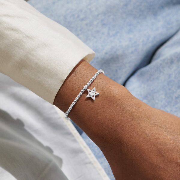 Joma jewellery silver plated beaded bracelet with hanging star charm presented on a sentiment card.