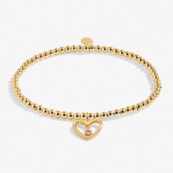 Joma jewellery gold plated beaded bracelet with open hanging heart charm and crystal detail.