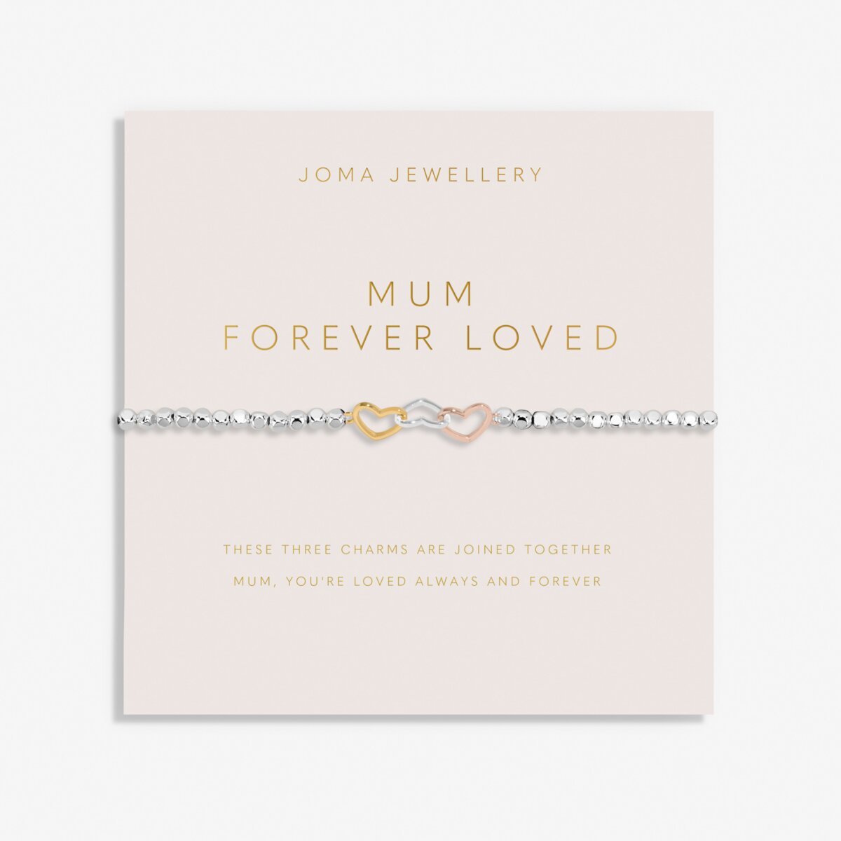 Joma Jewellery beaded bracelet with three interlinked hearts in silver, gold and rose gold presented on a blush pink sentiment card.