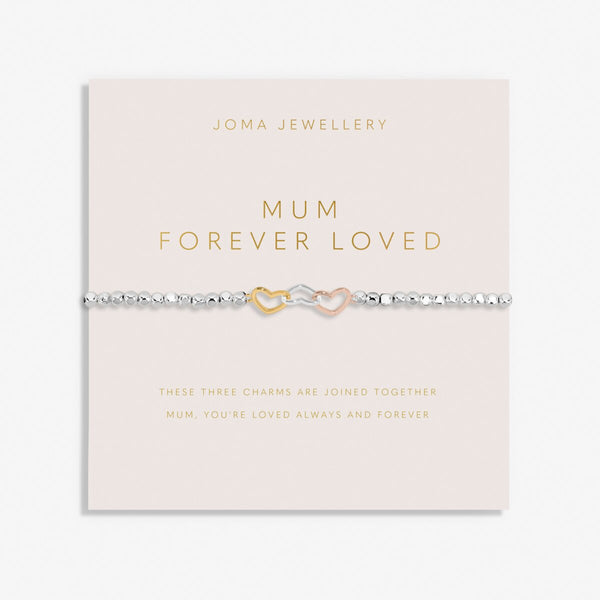 Joma Jewellery beaded bracelet with three interlinked hearts in silver, gold and rose gold presented on a blush pink sentiment card.