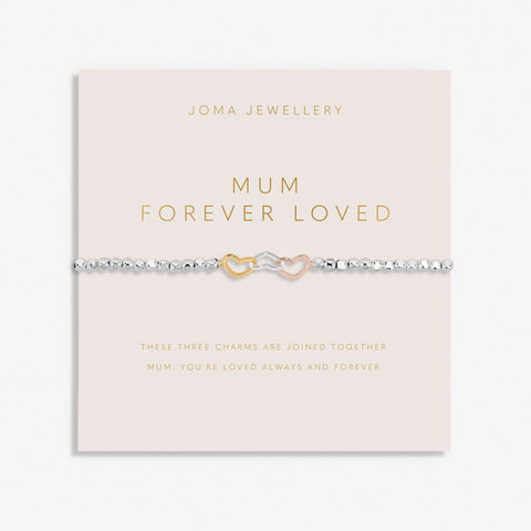 Joma Jewellery beaded bracelet with three interlinked hearts in silver, gold and rose gold presented on a blush pink sentiment card.