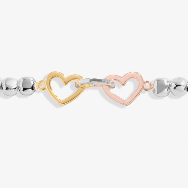 Joma Jewellery stretch beaded bracelet with interlinked heart charms in silver, gold and rose gold 