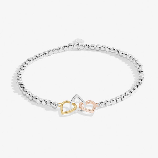 Joma jewellery stretch beaded bracelet with joined hearts in silver, gold and rose gold.