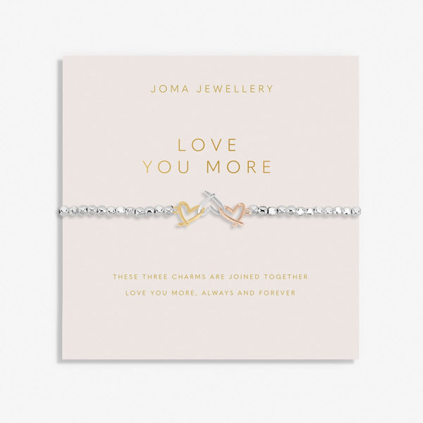 Joma Jewellery beaded bracelet with three open heart charms in silver, gold and rose gold.