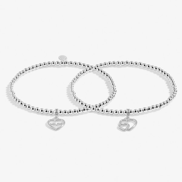 Joma jewellery Infinity bracelets. Two linked bracelets with individual open heart charms.  Comes in a beautiful box.