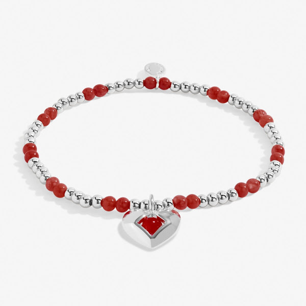 Joma Jewellery January birthstone bracelet featuring semi precious gemstones and heart charm.