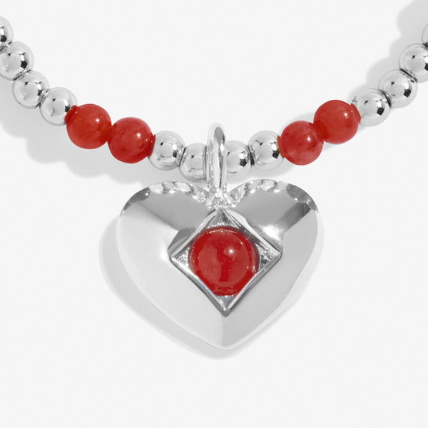 Joma Jewellery January birthstone bracelet featuring semi precious gemstones and heart charm.