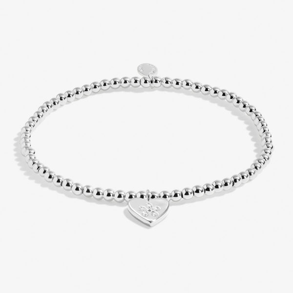 Joma Jewellery silver plated beaded bracelet with hanging heart charm and stamped flower highlight.