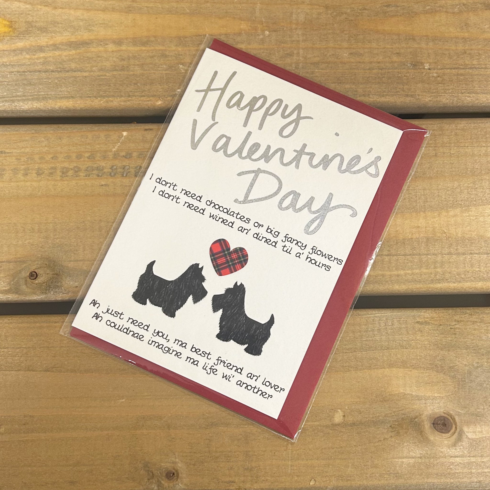 Scottish Valentine's Day cardfeaturing two Scottie dogs and a tartan heart with silver foil highlight.