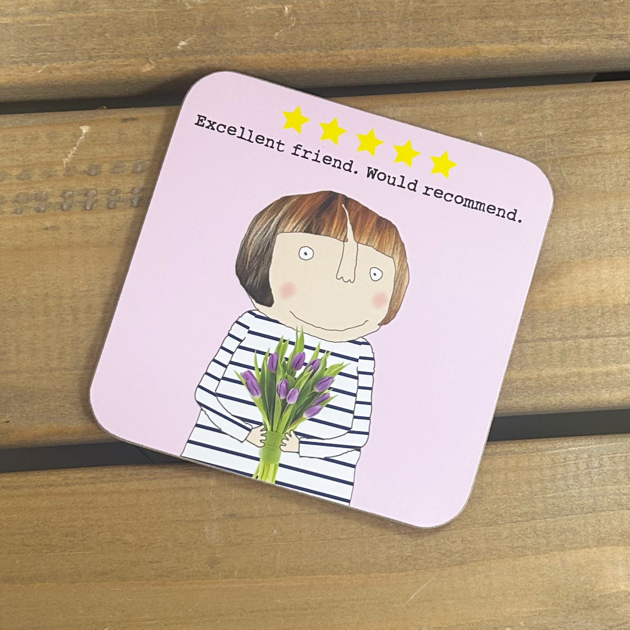 Corked back coaster featuring a friend holding a bunch of flowers in the Rosie signature style