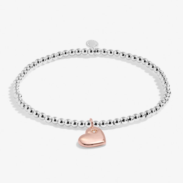 Joma jewellery girls bracelet with silver plated beads and rose gold hanging heart.