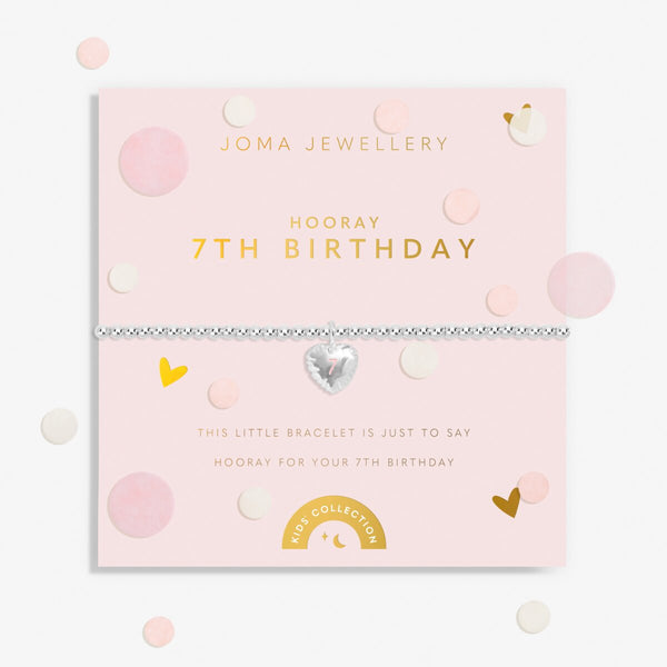 Joma jewellery girls silver plated beaded birthday bracelet with a hanging heart charm with a number 7 stamped in pink.