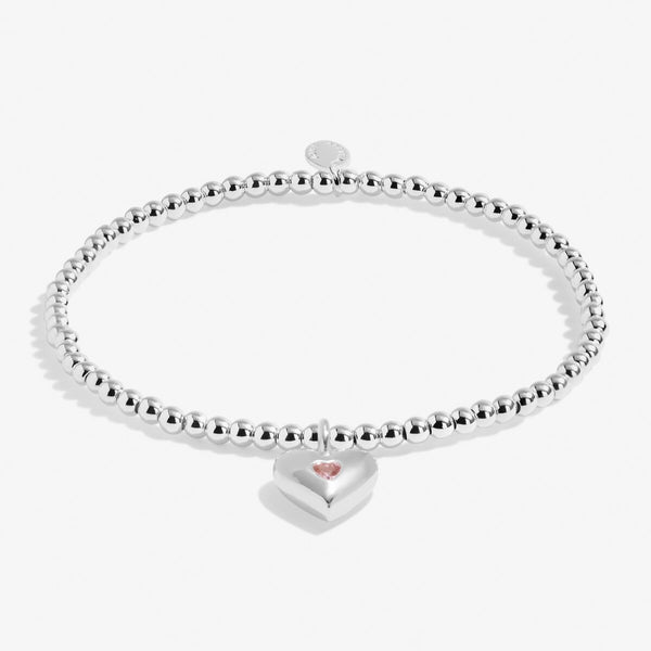 Joma jewellery girls silver plated beaded bracelet with hanging heart charm with pink crystal detail.