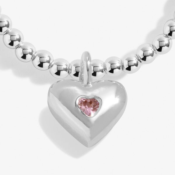 Joma jewellery girls silver plated beaded bracelet with hanging heart charm with pink crystal detail.