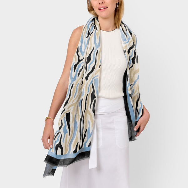 Katie Loxton abstract zebra printed scarf in ecru and blue with stylish frayed edges and lightweight fabric.