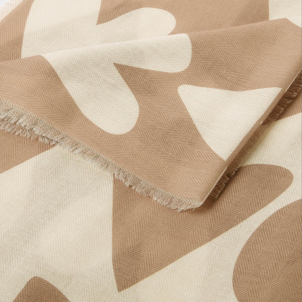 Katie Loxton printed scarf with large heart design in taupe and ecru with a stylish frayed finish.